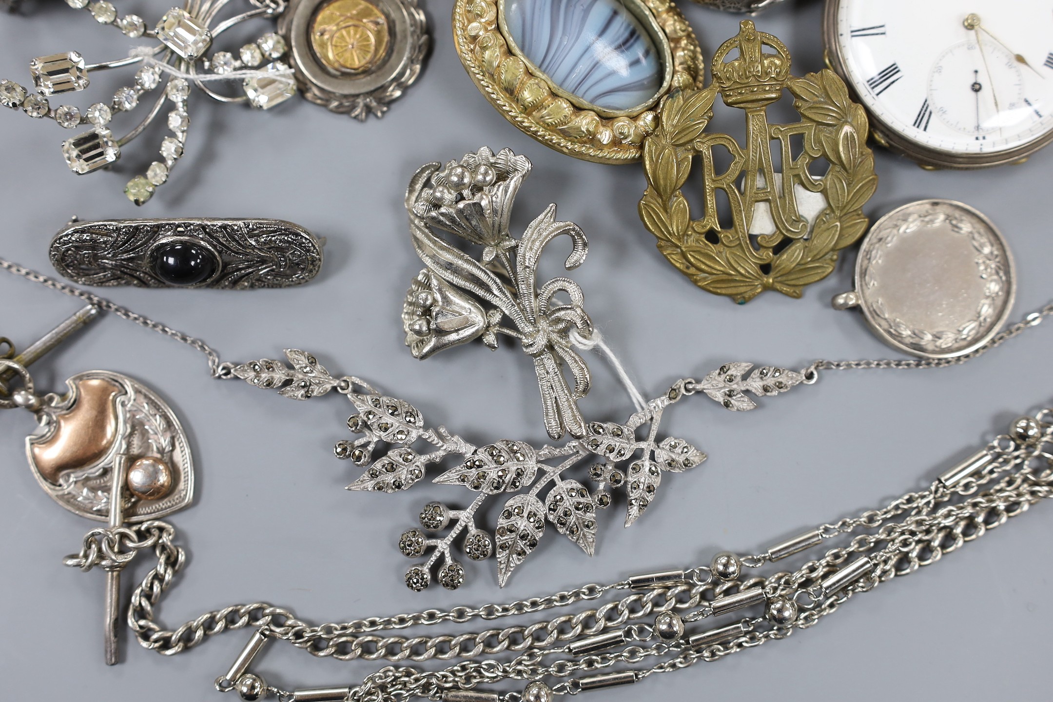 A mixed group of assorted silver and costume jewellery including a silver albert, Scottish hardstone brooch and two silver medallions, a silver fob watch, a white metal open faced pocket watch and a lady's steel Talis wr